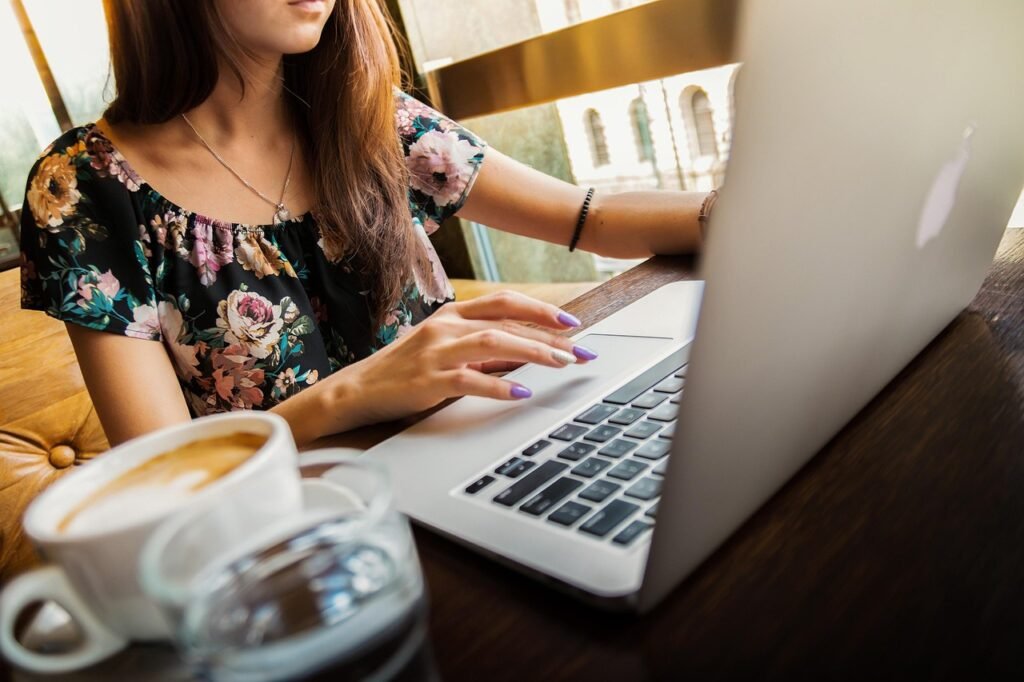 woman, laptop, desk, workspace, macbook, technology, work, coffee cup, working, working woman, coffee, computer, cup, girl, mug