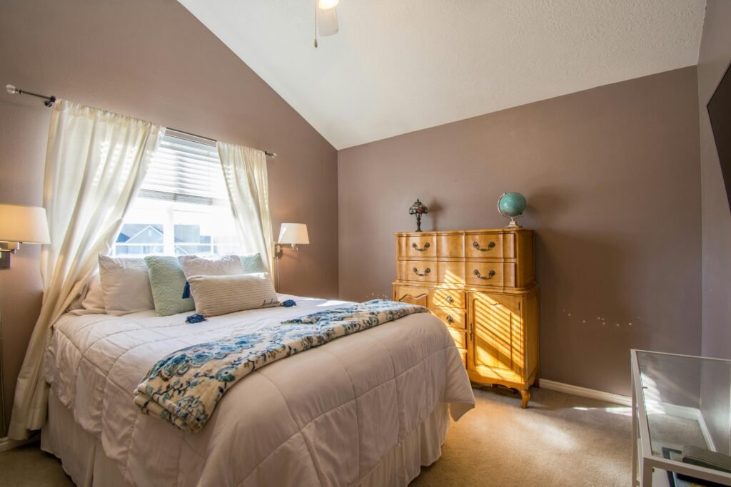Bright and inviting bedroom interior with neutral tones and elegant decor.