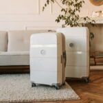 Stylish white suitcases displayed in a cozy living room setting.